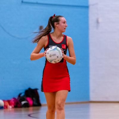 Centre for Staffs controls the ball at half court ready to make a pass