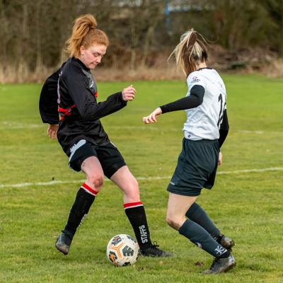 Staffs player runs into pressure from the oppositions defence