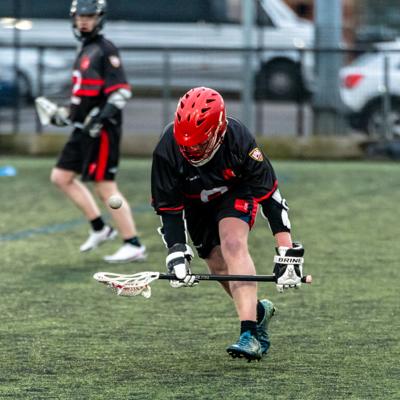 Staffs player collects the ball from the ground to claim possession