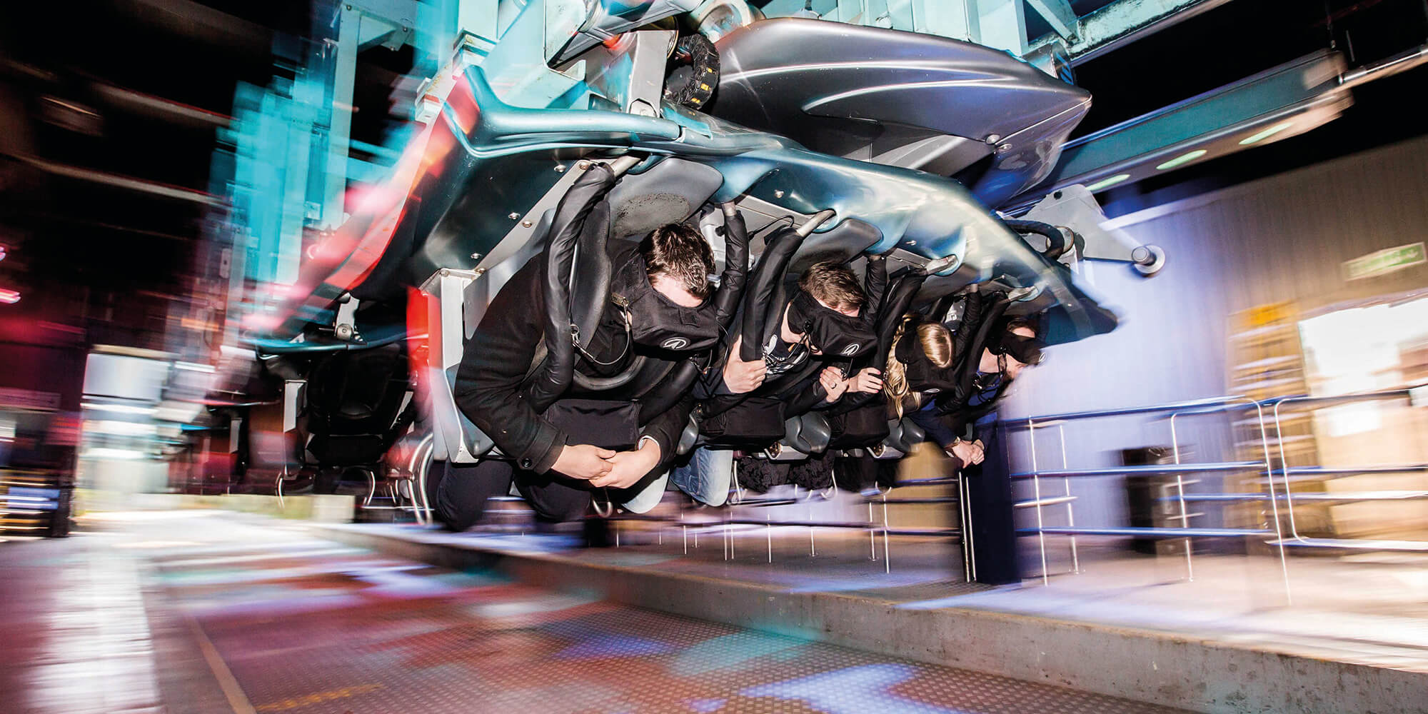 People using a rollercoaster ride